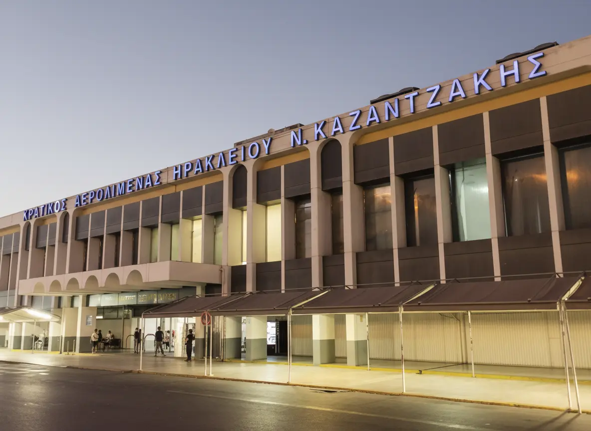 Exterior view of Heraklion Airport (HER) Nikos Kazantzakis terminal building during the evening